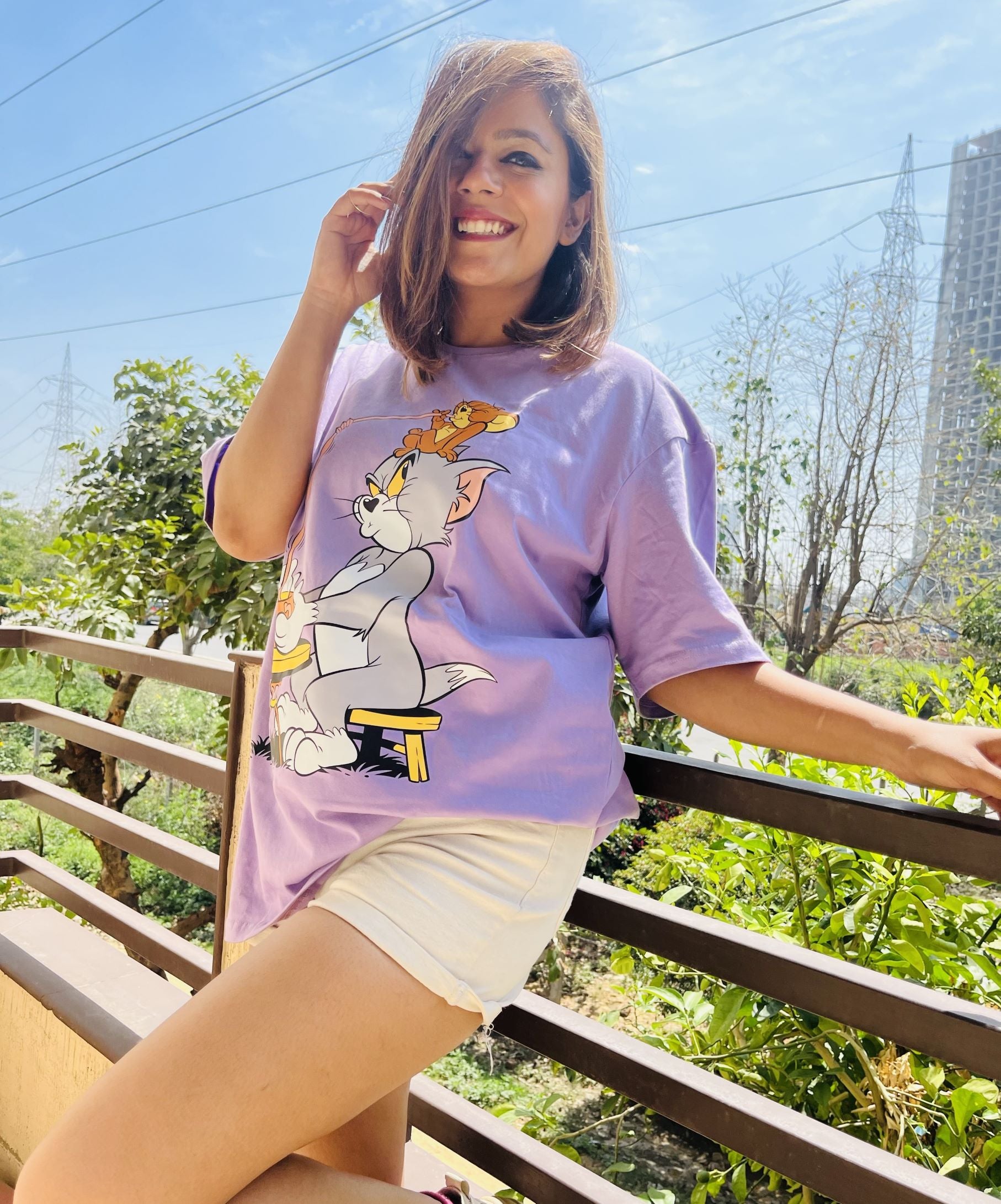 women wearing a tom and jerry oversized tshirt for women outside